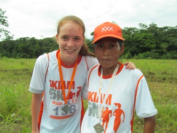 Sierra at a 5k race with the second-place finisher, an indigenous Kichwa woman who ran barefoot