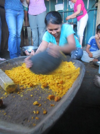 Ceci's sister, Lourdes, shows us how to mash the chonta fruit to make a drink called chicha
